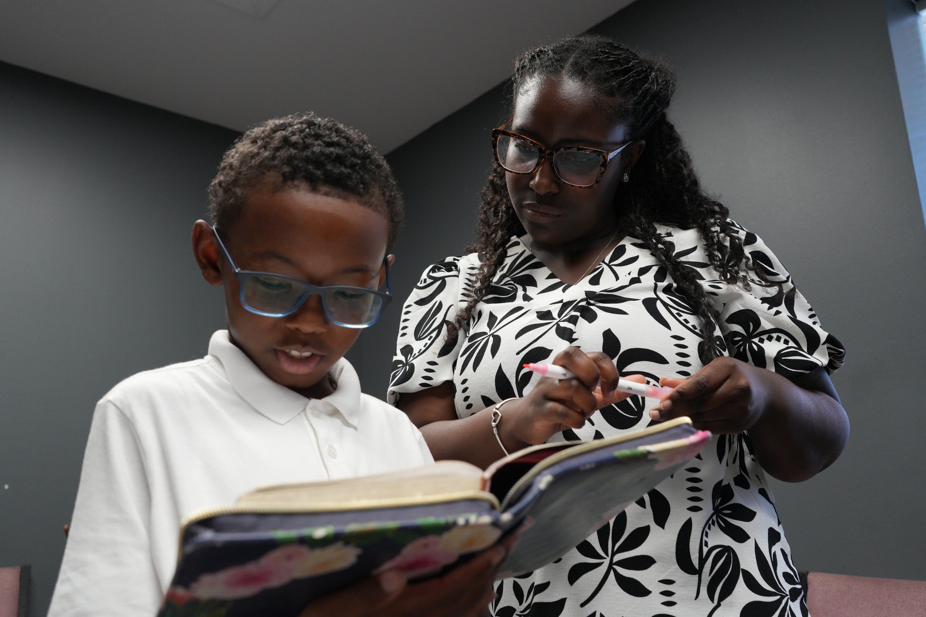 A child reading the Bible at Cornerstone